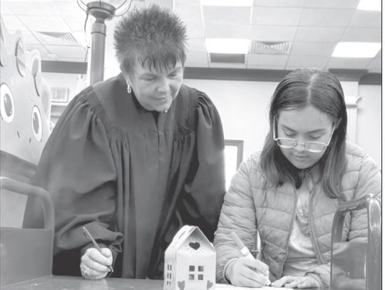 Dinosaur adoptions officiated by Judge Herndon at Pierce Library