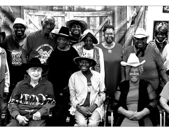 Isaac Moses helps local seniors celebrate Cowboy Day