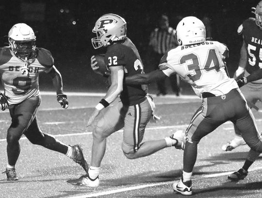 Johnson, McClellan run wild in 65-20 homecoming win