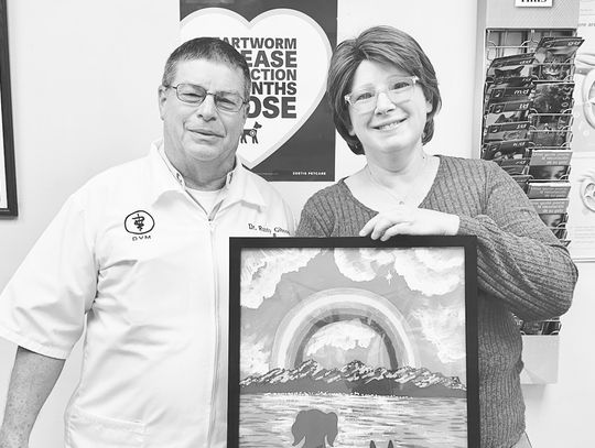 Jordan presents heartfelt print to Dr. Russell Gibson