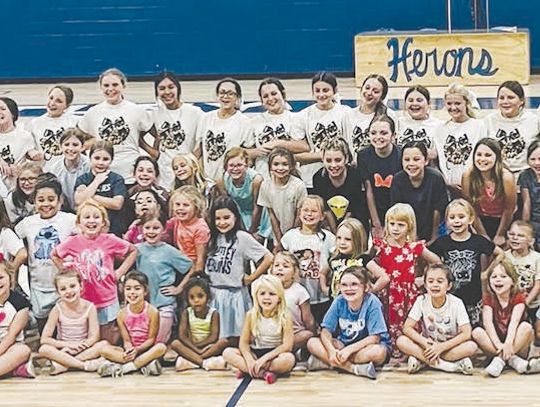 Little cheerleaders learn from BCMS cheerleaders Little cheerleaders learn from BCMS cheerleaders