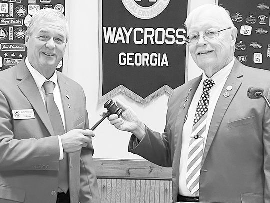 McSwain receives gavel, Exchange honors Johnson