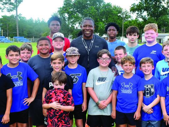NFL pro Adrian Peterson holds free football camp
