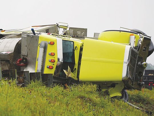 One injured when tanker flips on side