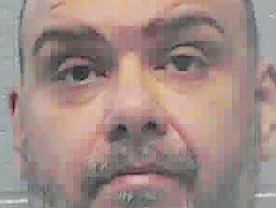 Prison inmate charged in bomb threat