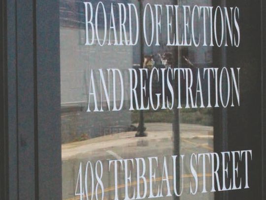 Purple ribbon brings about complaint on election office