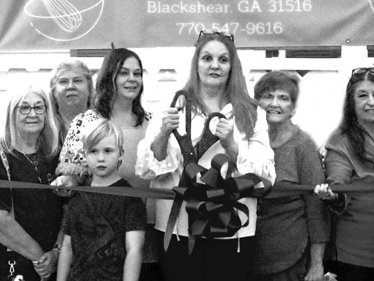 Three Boys Bakery cuts cookies and ribbon