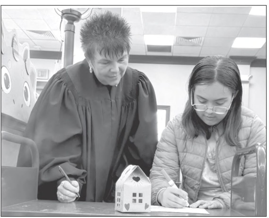 Dinosaur adoptions officiated by Judge Herndon at Pierce Library
