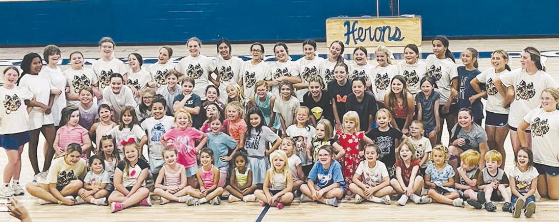 Little cheerleaders learn from BCMS cheerleaders Little cheerleaders learn from BCMS cheerleaders