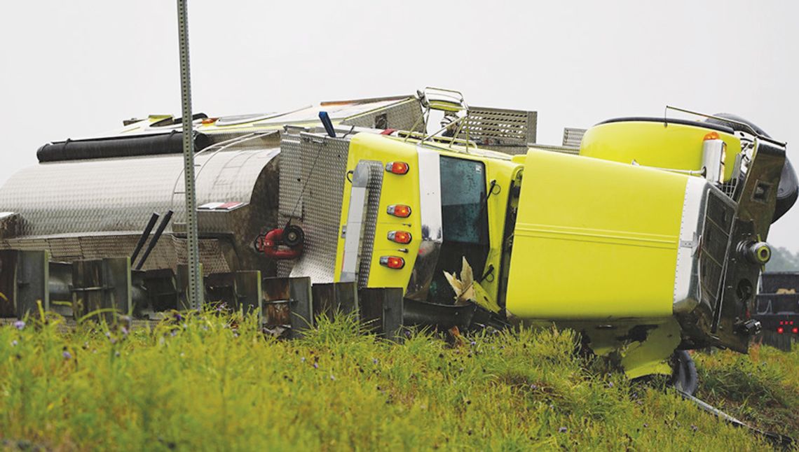One injured when tanker flips on side