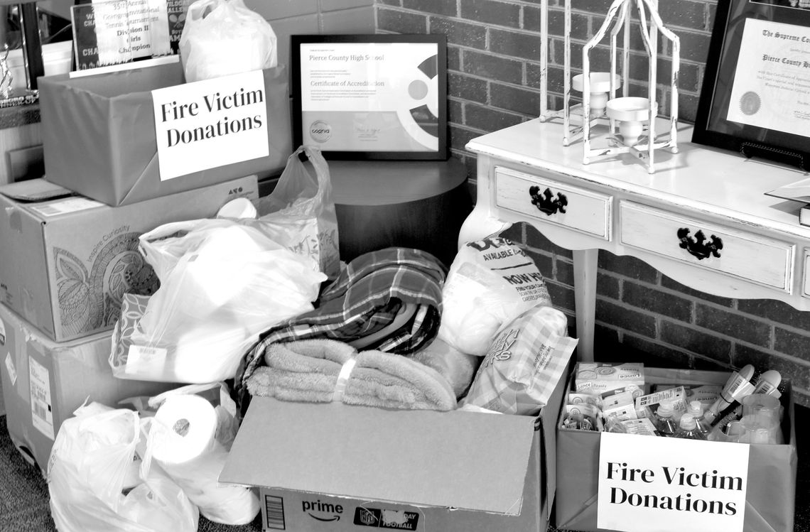 PCHS staff collect donations for fire victims