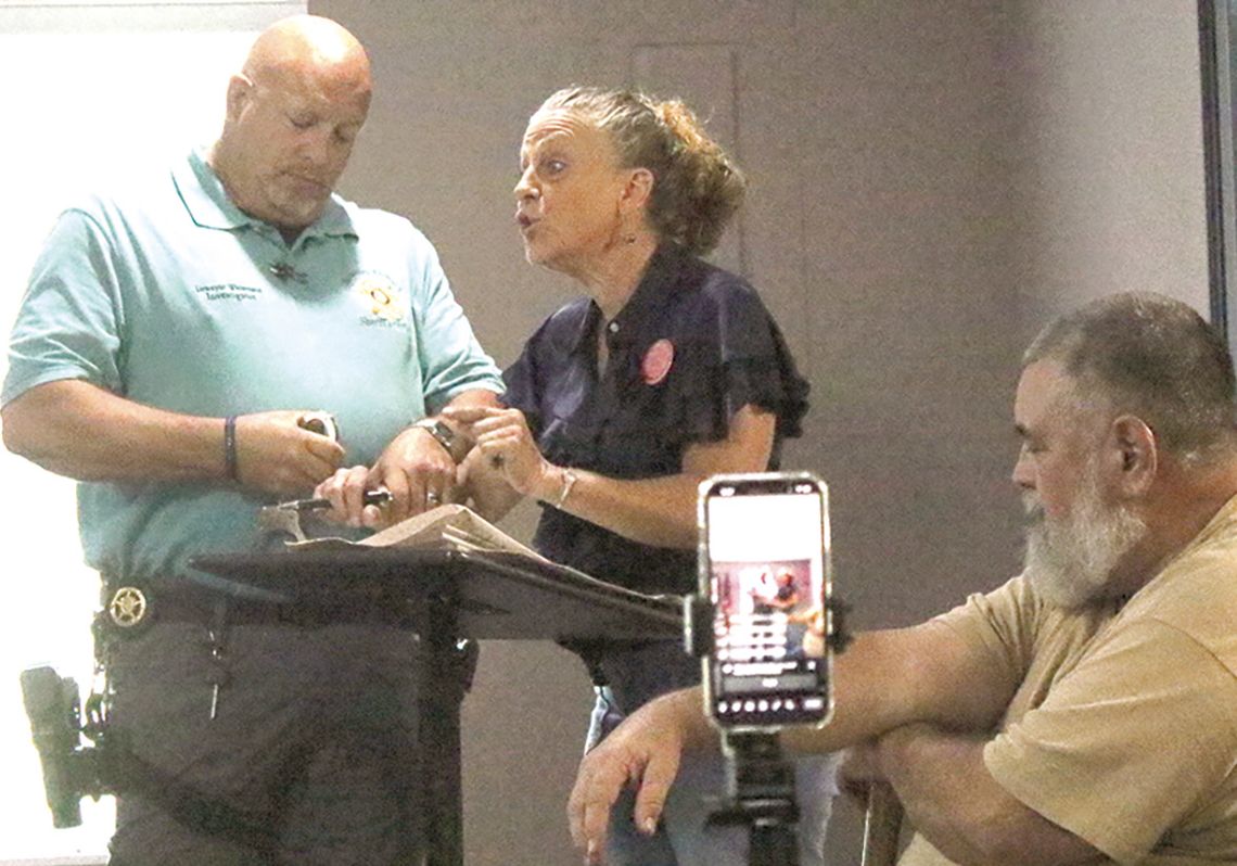Removal in handcuffs interrupts work session Removal in handcuffs interrupts work session