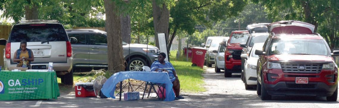 Senior Center drive through gives out healthy produce and ice cream
