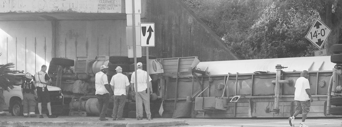 Tanker overturns in Carswell underpass Tanker overturns in Carswell underpass