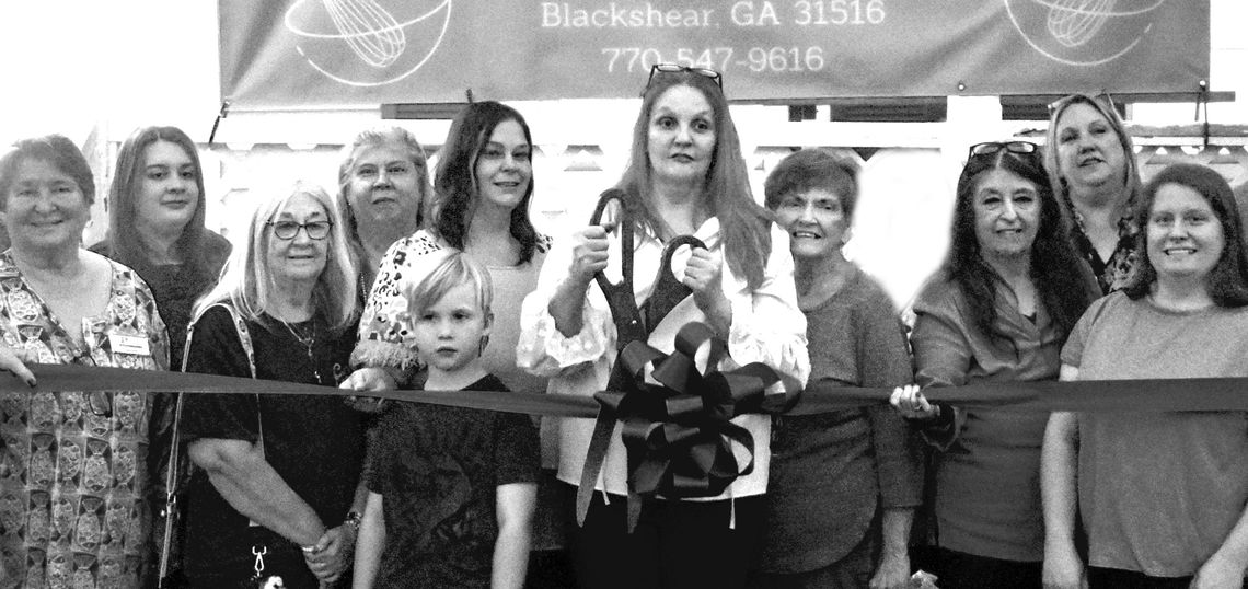 Three Boys Bakery cuts cookies and ribbon
