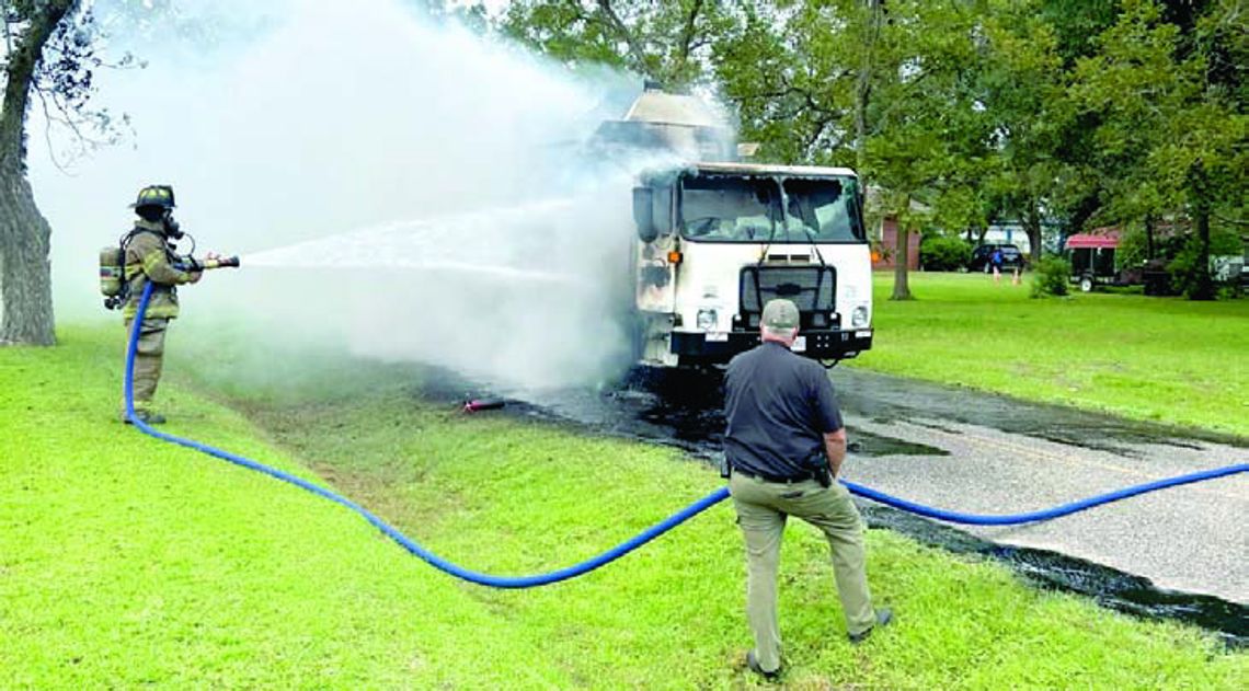 Trash truck catches fire Trash truck catches fire