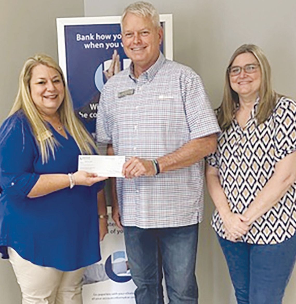 United Community presents $500 to Rebuilding Together