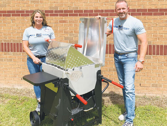 <p>Denise and Chad Brown are shown with the Outdoor Gourmet 90 quart boiler being raffled off Sept. 29. Proceeds will benefit the Pierce County Middle School Cross Country teams.</p>