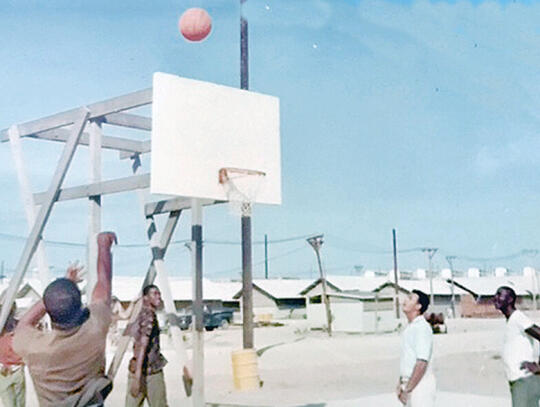 <p>Augustus Amos “Gus” Fulton Jr. is a champion basketball player. Fulton played on Lee Street High’s state championship teams in the 1950s and with his fellow soldiers while serving in Vietnam, above.</p>