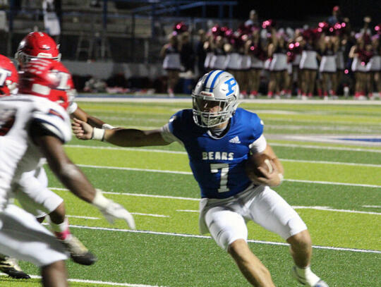 <p>Bear quarterback Cole McGatha (7) tries to get past Toombs County defenders Friday night.</p>