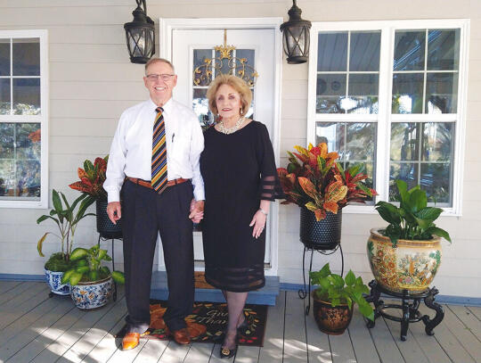 <p>Former Pierce County School Superintendent W. D. Strickland and wife Susan welcome Pierce County Historical Society members to Satilla River Historic Home.</p>