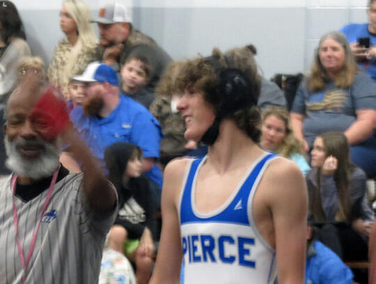 <p>Bear wrestler Chris Johns smiles during a recent home match.</p>