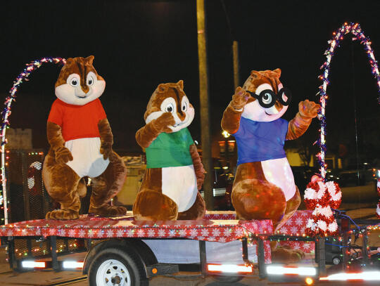 <p>Pictured above The Chipmunks— (l-r) Alvin, Theodore and Simon — wave to the crowd along Main Street and perform their hit single “Christmastime is Here."</p>