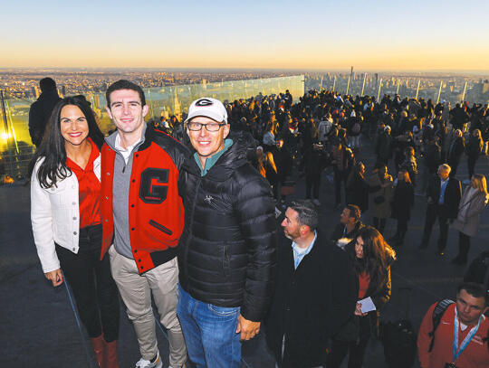 <p>Steston Bennett IV is shown while in New York for the Heisman Trophy ceremony with his parents, Denise Bennett and Stetson Bennett III.</p>