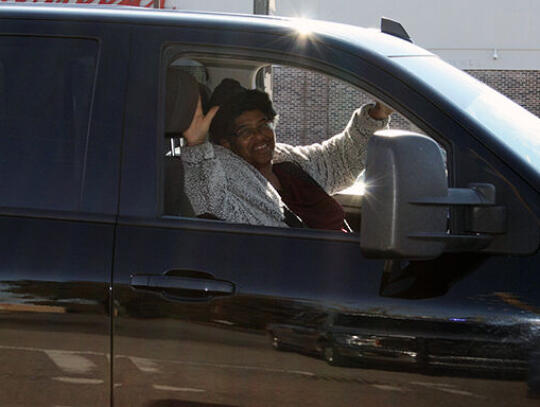 Elder Jacqueline Wallace waves to the crowd.