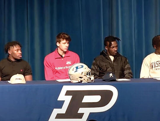 Pictured, l-r, Jimarion Guyton, Jonah Allen, DJ Bell and JaQuez White signed scholarships during a ceremony Feb. 1. Recognized for their academic and athletic accomplishments, Bell, Allen, Guyton and White are set to play for schools across the United States.