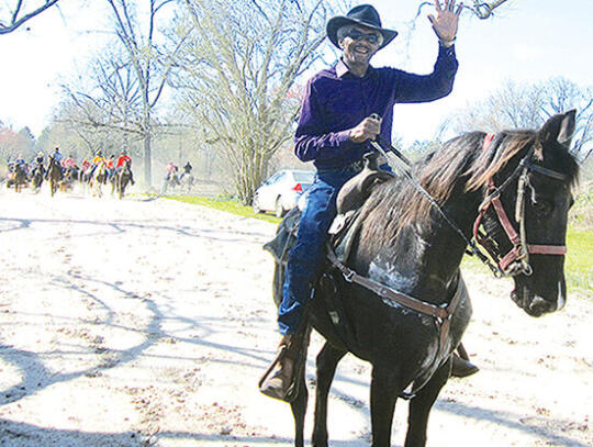 Isaac Moses leads the trail ride in this photo from one of the past Cowboy Day events.