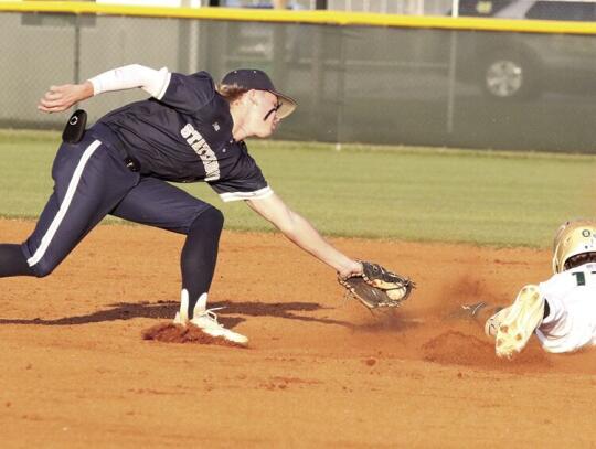  Easton Weathersby slides safely into second eluding the tag attempt of Statesboro shortstop Avery Newton on a stolen base attempt in the second inning of Ware County’s series-clinching 5-3 Region 1-AAAAA win Thursday over visiting Statesboro. 