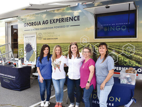 The GA AG Experience’s visit was a collaborative effort between the Georgia Foundation for Agriculture, Pierce County Farm Bureau and Pierce County Board of Education. Pictured (l-r) Teresa Dixon (Board of Education), Julie Steedley (Pierce County Farm Bureau Office Manager), Lily Baucom (...