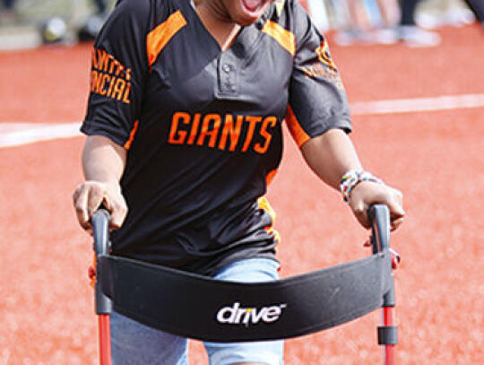 Dorcas Harris is all smiles during the champion’s walk at the Miracle League’s opening day ceremonies Saturday.