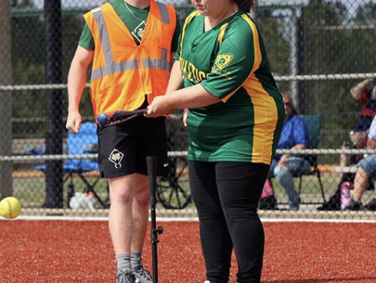 Ashton Dixon is all smiles during the champion’s walk at the Miracle League’s opening day ceremonies Saturday.