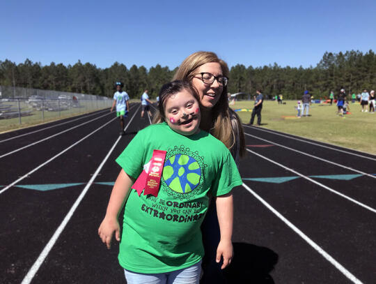 Lily Simpson (left) displays her high placement ribbons as she poses with Julie Tanner. Simpson competed in the tennis throw, and placed first in the 50 meter dash. Athletes from all of Pierce County’s schools brought home high placements and were awarded with medals at the closing ceremon...