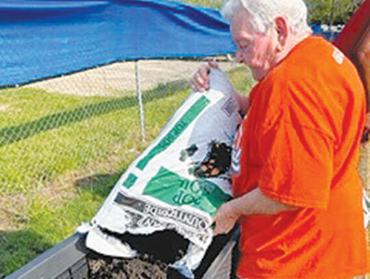 Barbara Thornton is shown preparing one of the raised beds.                       -Photos courtesy Pierce County Senior Center