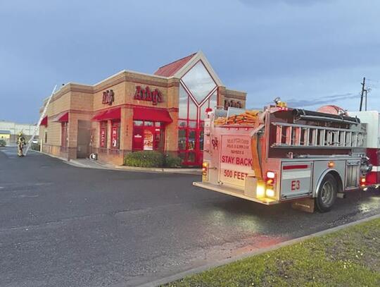 Smoke rolls from Arby's Entrance