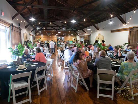 A large crowd gathered in the newly renovated Railroad Depot for the event — under the Havana lights.