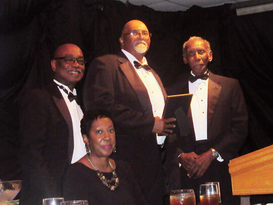 Terrence Lott was recognized as the Man of the Year by the 100 Black Men of Southeast Georgia. Shown l-r are Elder Troy Jackson,  Justice Verda Colvin, Lott and Reginald Taylor.