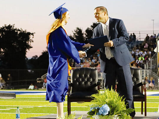 Valedictorian Addison Cantrell receives her diploma from PCHS Principal Kelly Murray.