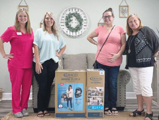 Picture above, l-r:  Christy Norwood - Southeast Georgia Women’s Center RN, Staci Lucas - Executive Director, Judy Prince - center client, and Ronda Sauls - volunteer advocate.