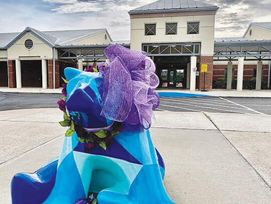 A wreath and bow in Denison’s favorite color, purple, decorates the Bear in front of Blackshear Elementary School.